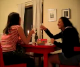 Two girls offer a toast at dinner and begin to drink their glasses of wine, when all of a sudden, the girl on the left lets out a horrendously, deep, long fart and shocks her friend!